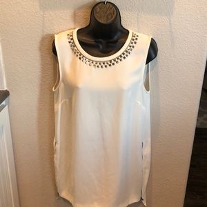 Beige 100% polyester blouse.